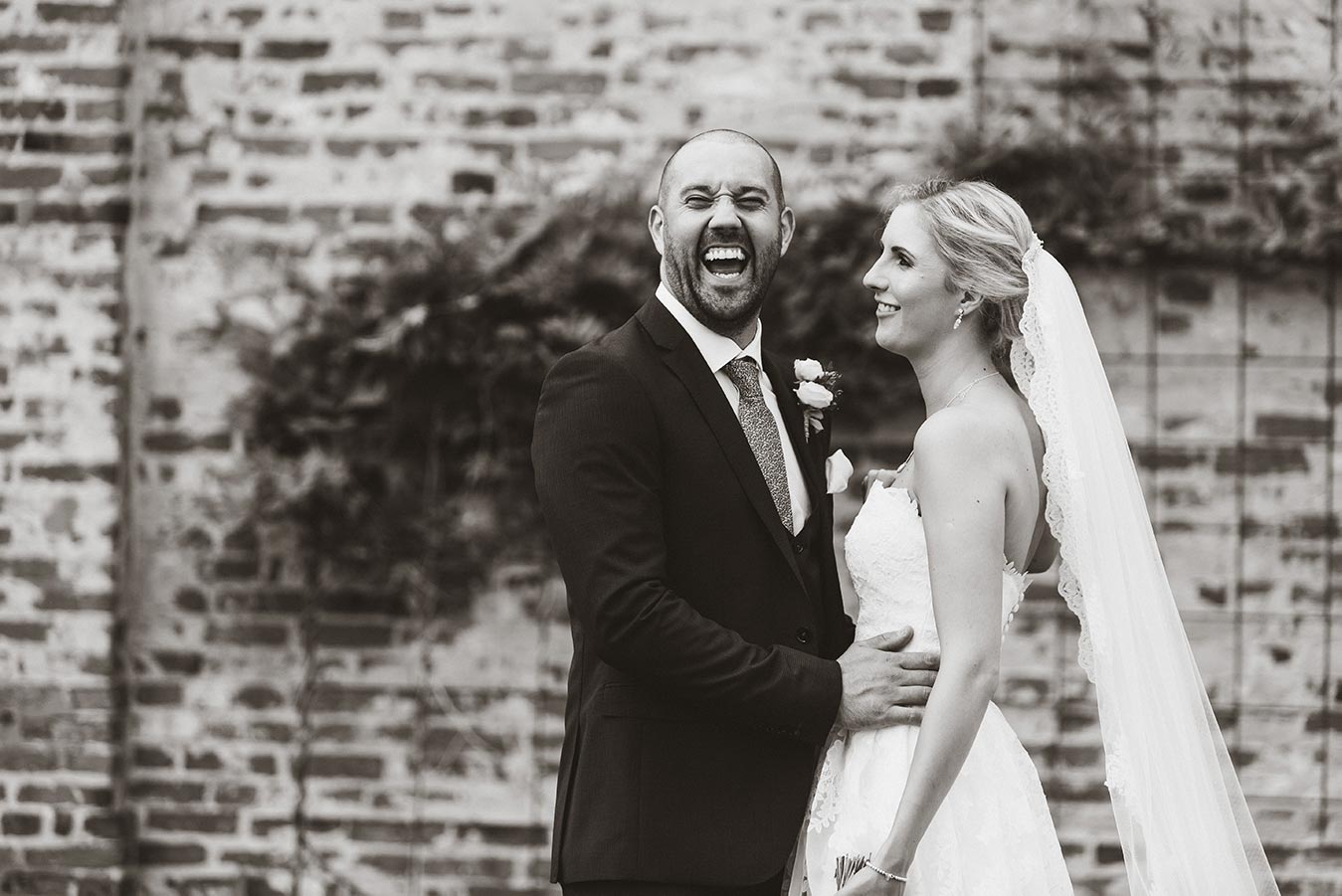 stunning black and white portraits at a Nottingham wedding of couple laughing