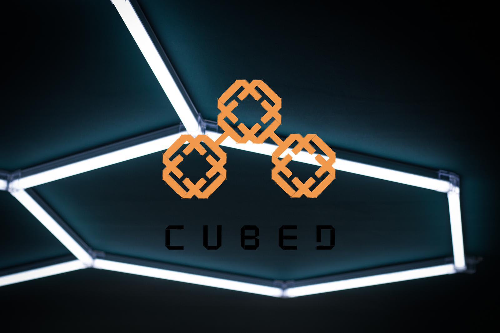 Starting a business from scratch podcast image. Cubed Cuts and coffee logo overlaid on a hexagonal light feature in the shop.
