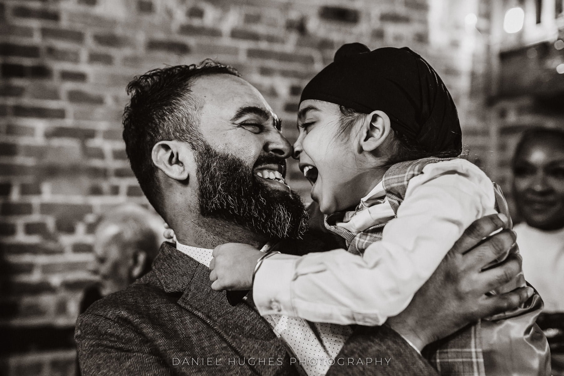 father and son smiling at each other on the dance floor at Curradine Barns